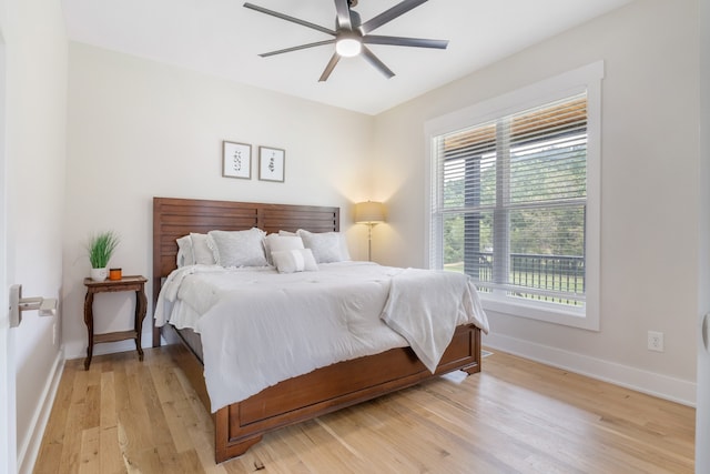 bedroom featuring ceiling fan and light hardwood / wood-style flooring