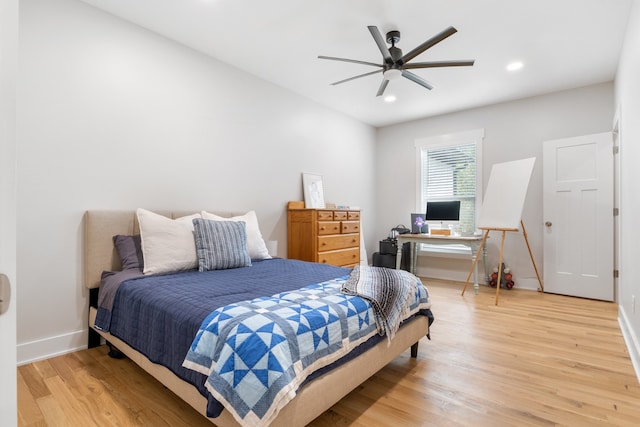 bedroom featuring hardwood / wood-style flooring and ceiling fan