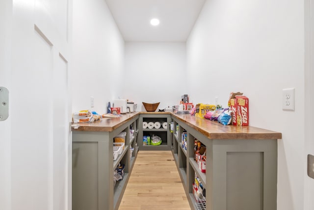 bar featuring gray cabinetry and light wood-type flooring