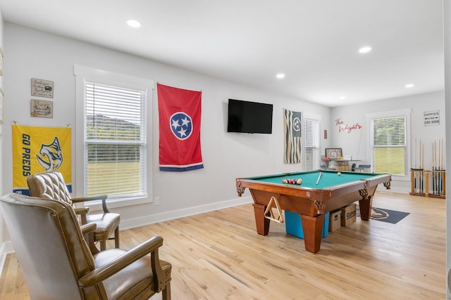 recreation room with billiards and light hardwood / wood-style flooring