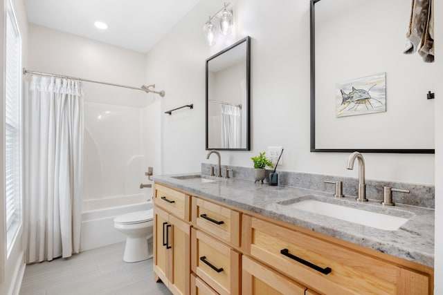 full bathroom with vanity, toilet, and shower / tub combo with curtain