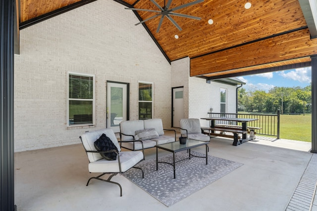 view of patio / terrace with ceiling fan and an outdoor living space