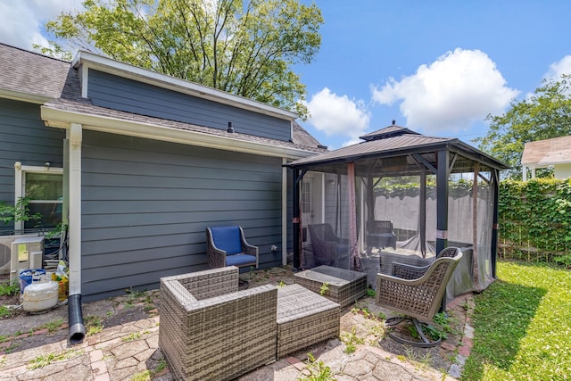 view of patio featuring a gazebo and ac unit