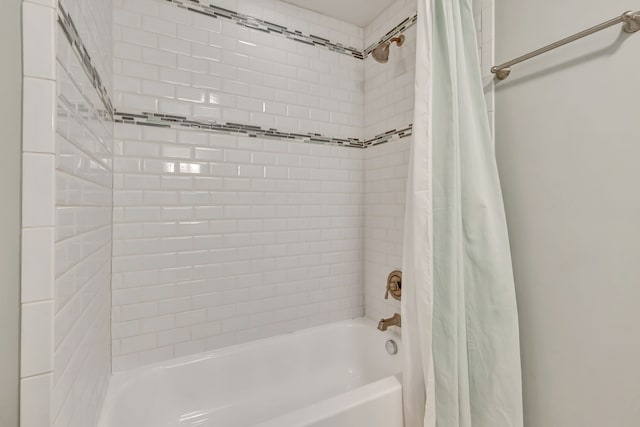 bathroom featuring shower / bath combo with shower curtain