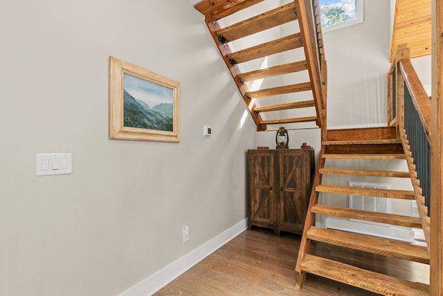 stairway featuring hardwood / wood-style flooring