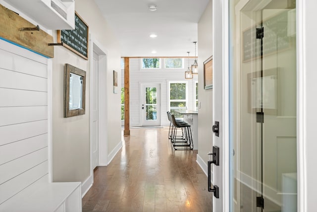 hall with hardwood / wood-style floors