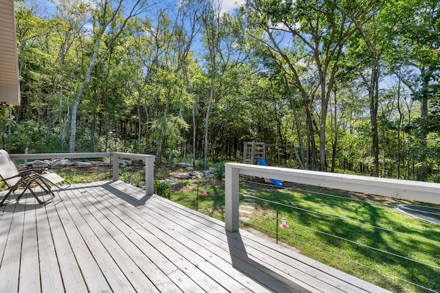 wooden deck featuring a yard