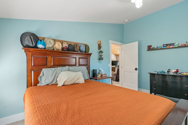 bedroom with light carpet