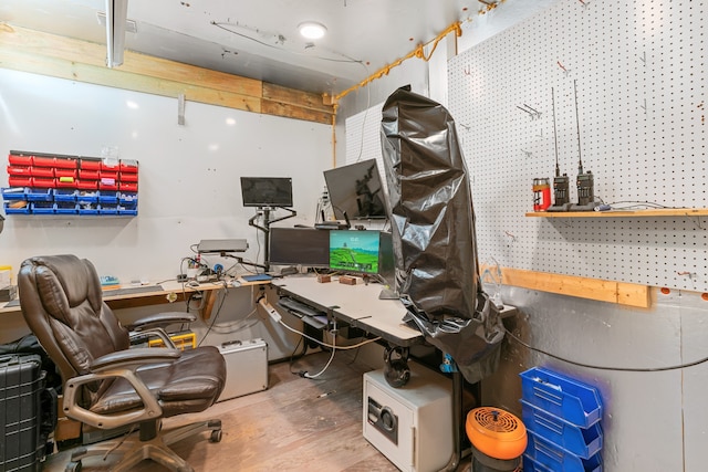 office space with a workshop area and hardwood / wood-style flooring