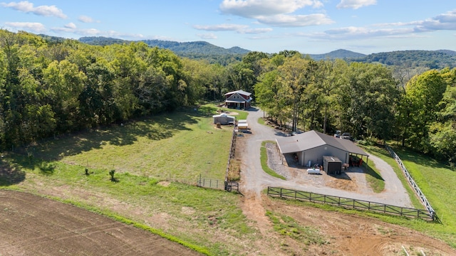 bird's eye view featuring a mountain view and a rural view