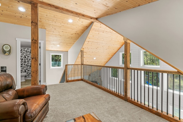 living area featuring carpet, wooden ceiling, beamed ceiling, and high vaulted ceiling