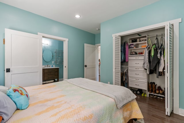 bedroom with a closet and dark hardwood / wood-style floors