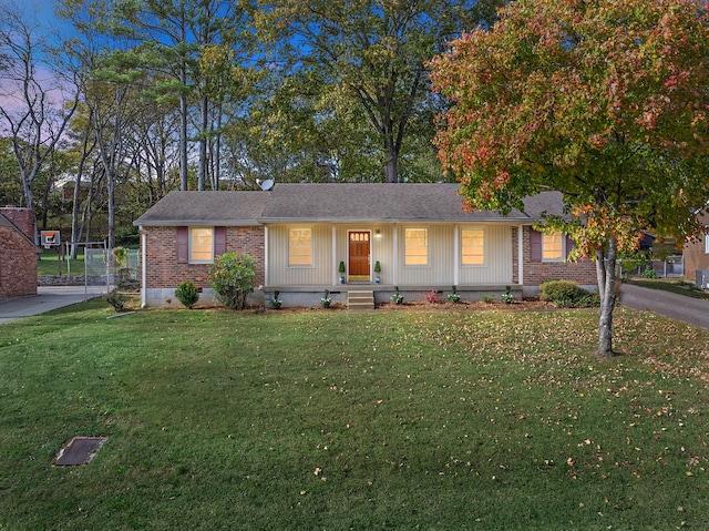 ranch-style house featuring a yard