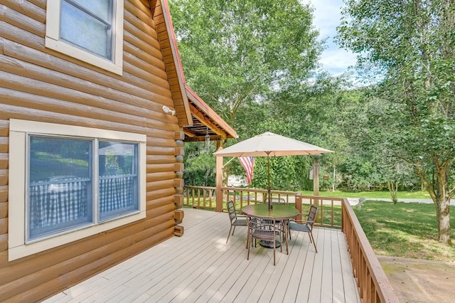 wooden deck with a yard