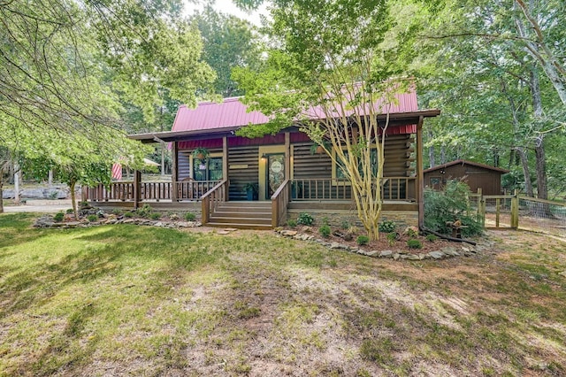 log-style house with a front yard