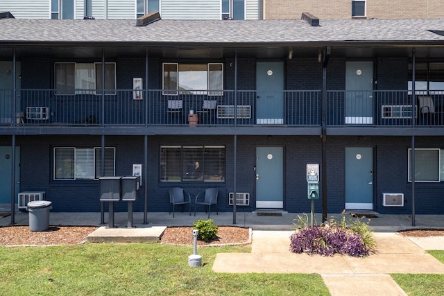 view of building exterior with central AC unit