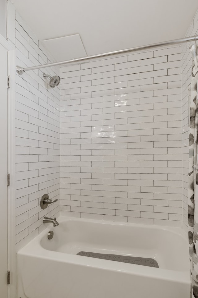 bathroom featuring shower / bath combo with shower curtain