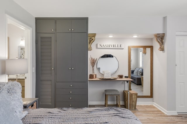 bedroom featuring a closet and light hardwood / wood-style flooring