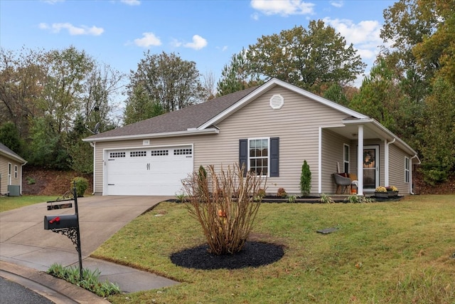 ranch-style house featuring a garage and a front lawn