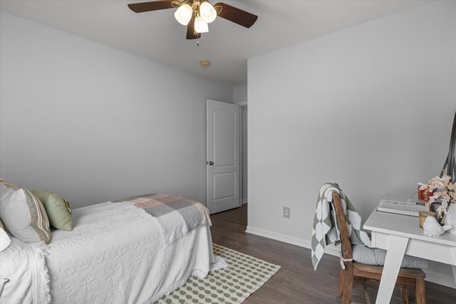 bedroom with ceiling fan and dark hardwood / wood-style floors