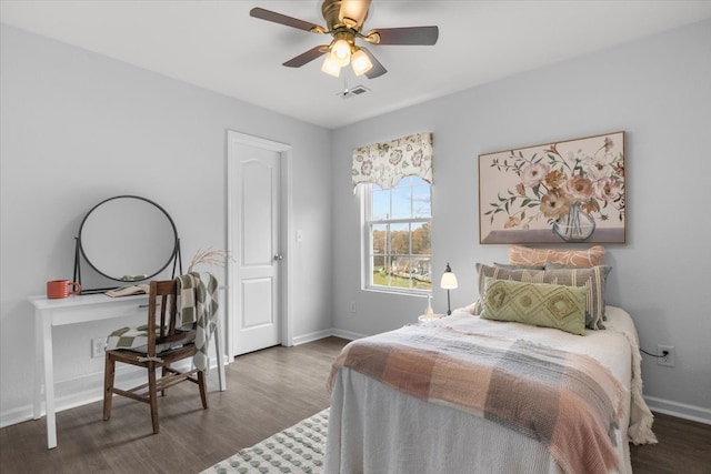 bedroom featuring dark hardwood / wood-style flooring and ceiling fan