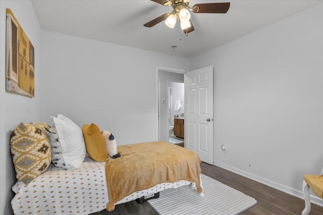 bedroom with dark hardwood / wood-style flooring and ceiling fan