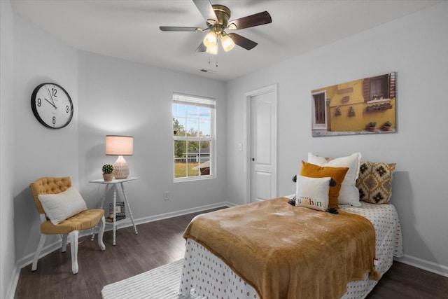 bedroom with ceiling fan and dark hardwood / wood-style flooring