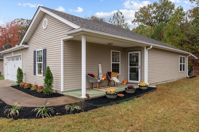 exterior space featuring a patio, a garage, and a lawn