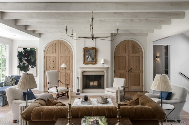 living room featuring wood-type flooring and beam ceiling