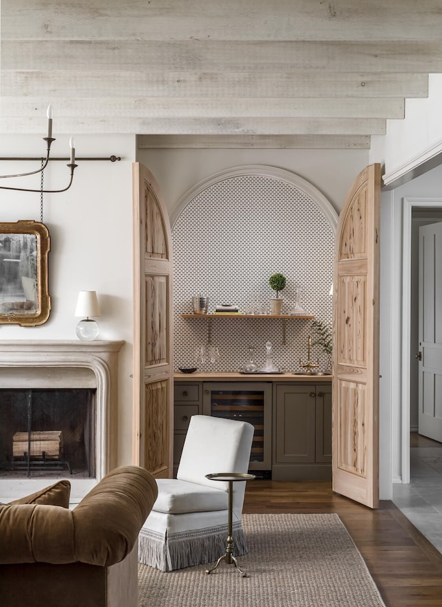 living area with dark wood-type flooring and beverage cooler