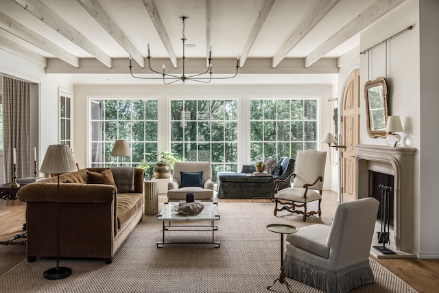 sunroom with beamed ceiling and a healthy amount of sunlight