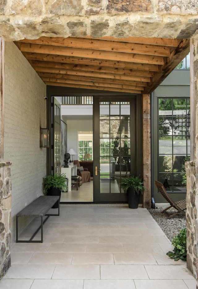 property entrance featuring a patio