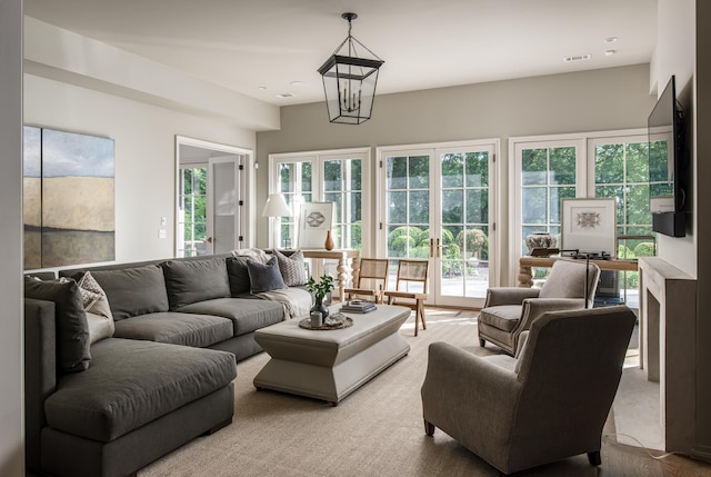 living room featuring an inviting chandelier