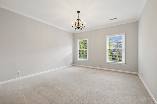 empty room featuring light colored carpet, an inviting chandelier, and ornamental molding