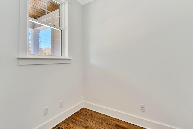 unfurnished room with hardwood / wood-style floors