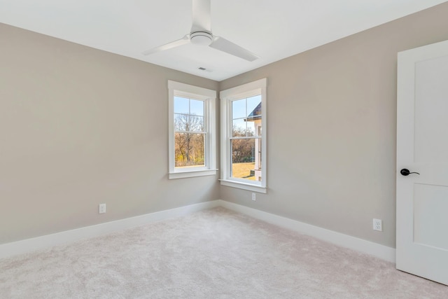 carpeted empty room with ceiling fan