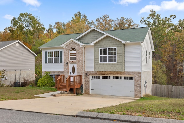 raised ranch featuring a garage