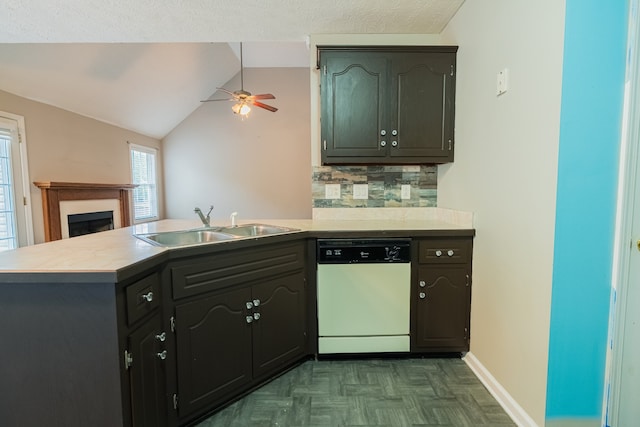 kitchen featuring white dishwasher, vaulted ceiling, kitchen peninsula, sink, and dark parquet flooring