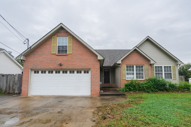 view of front facade featuring a garage and a front lawn