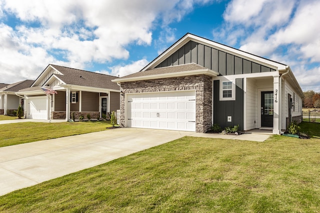 view of front of property featuring a garage and a front lawn