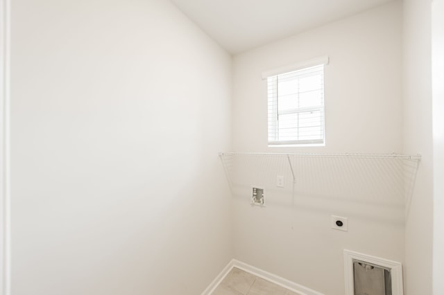 laundry room featuring hookup for a washing machine, electric dryer hookup, and light tile patterned floors