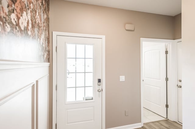 doorway with light hardwood / wood-style flooring