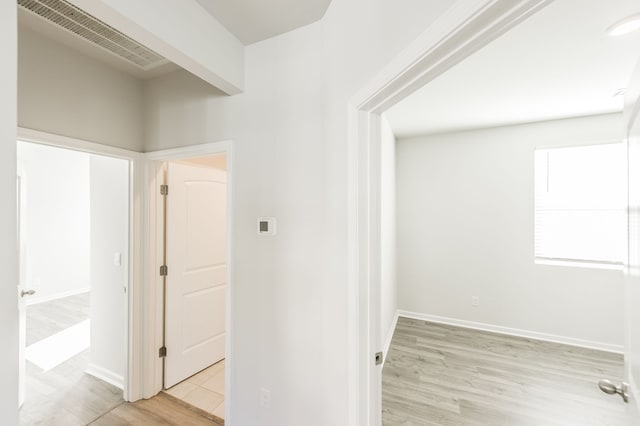 hallway featuring light hardwood / wood-style flooring