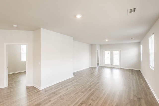 unfurnished room featuring light hardwood / wood-style floors