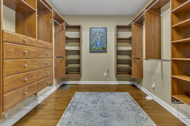 walk in closet featuring hardwood / wood-style floors