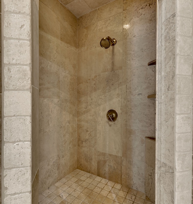 bathroom with a tile shower