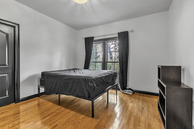 bedroom with light wood-type flooring and pool table