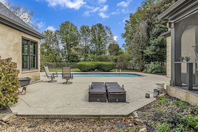 view of patio / terrace featuring a fenced in pool