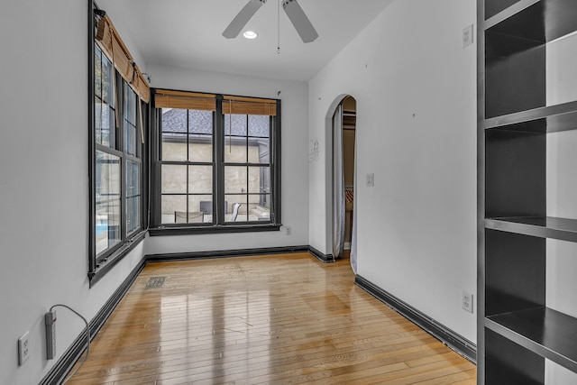 spare room with ceiling fan and light hardwood / wood-style flooring