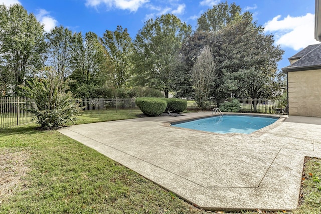 view of swimming pool with a lawn and a patio